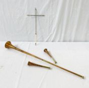 A copper hunting horn, 94cm approx. two smaller 23cm and 22.5cm approx. etc (4)