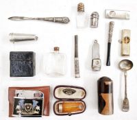Silver-gilt cigar cutter, a silver salt spoon, a silver cigar cutter, a silver cheroot holder case