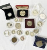 Tin box of coins containing some proof silver coins (world) and three silver Indian rupees