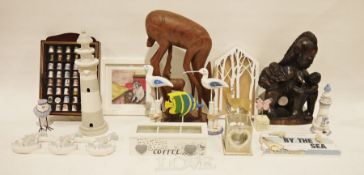 Carved hardwood model of an antelope and calf, a carved wooden figure set of female with two