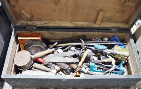 Vintage wooden toolbox containing assorted tools including hand drills, planes, chisels, rasps,