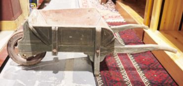 Child's painted wooden wheelbarrow