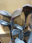 Assorted antique golf clubs in case