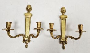 Pair of gilt two-branch wall sconces with pineapple finials, 29cm (2)