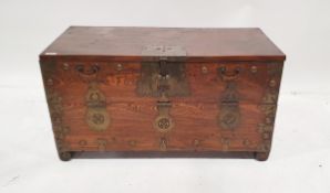 Antique Oriental traveller's chest, brass bound with fall front, on scroll carved feet Condition