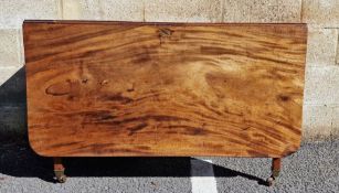 19th century mahogany drop leaf dining table on straight legs and castors, 114cm