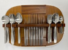Elkington stainless steel flatware on a teak fitted mount