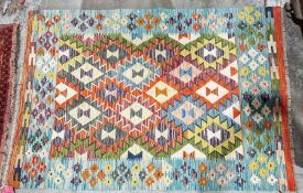 Chobi orange ground kilim with lozenge trelliswork and floral border, 155cm x 107cm