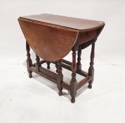 Antique oak gateleg dining table, oval on baluster supports, cross-stretchers opening to 108cm