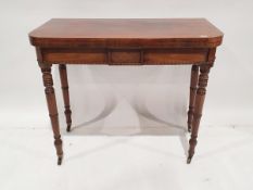 19th century mahogany card table, square with rounded corners, on turned supports to brass casters