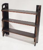 Carved oak two-tier wall rack with foliate scroll carved frieze, egg and dart carved borders, 60.6cm