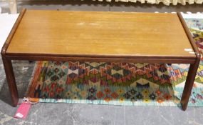 1960's teak coffee table of rectangular form with rounded supports, 37cm high x 97cm wide x 48cm