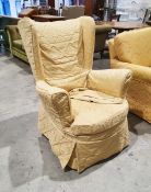 Early 20th century wing back armchair with gold floral upholstery