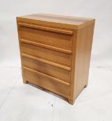 Contemporary oak veneered chest of drawers with four graduated long drawers, on tapering feet, 87.