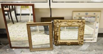 Pair of modern gilt rectangular wall mirrors, a white rectangular wall mirror with blue posy