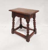 Antique oak joint stool with moulded edge on turned angled legs and stretchered support