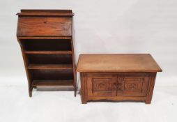 Modern oak side two door cupoard by 'Wulters Herrhugowaard Holland' with carved floral panels to