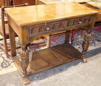 Reproduction 17th century-style oak side table having two drawers with nulled carving, on carved cup
