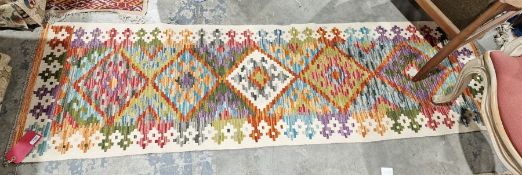 Chobi kilim cream ground runner with one row of  five stepped lozenge medallions to a geometric