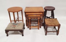 Modern oak nest of three tables, a square rush seated stool, two further stools and a mid century