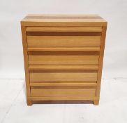 Contemporary oak veneered chest of drawers with four graduated long drawers, on tapering feet, 87.