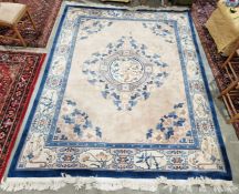 Large cream ground Chinese superwash carpet with centralised floral medallion enclosed by floral
