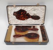 Asprey gold inlaid simulated tortoiseshell dressing table set of six pieces viz:- hand mirror,