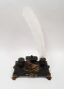 Gilt metal mounted black slate inkstand, having two pots and surmounted by lion, on paw feet, 20cm