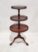 Mahogany circular three-tier whatnot on claw and ball feet Condition ReportAdditional photos added