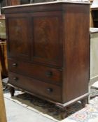 Victorian mahogany linen press with applied moulding to the rectangular top  the two door cupboard