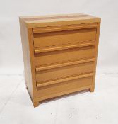 Contemporary oak veneered chest of drawers with four graduated long drawers, on tapering feet, 87.