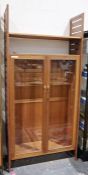 Ladderax teak display unit having wooden slatted sides, glass panelled doors, on straight
