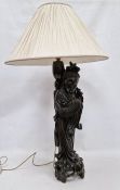 Carved wooden table lamp in the form of an oriental figure