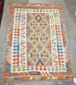 Turkish Anatolian cream ground kilim with central lozenge pattern to multiple geometric borders,