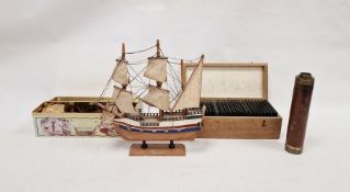 Early 20th century boxed collection of slides of views of bridges, churches and UK landscapes, a