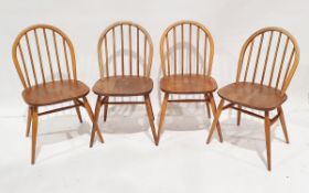 Ercol beech and elm dining table of shaped rectangular form, on tapering square legs, 130cm wide x