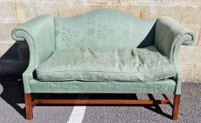 Two-seater green upholstered settee on mahogany stretchered base, 146cm