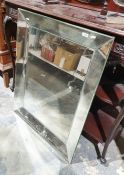Large contemporary mirror of rectangular form with bevel edged borders and central plate, 75cm x