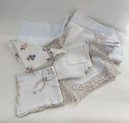 Three vintage damask table cloths, an embroidered table cloth, eight machined lace and embroidered