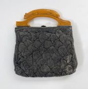 1930'S bag, black, ruched leather bag with bakelite single handle in the form of wolf/dog lying on a