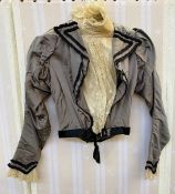 Grey silk shirt waist bodice with leg o' mutton sleeves, lace trim, boned, lace insert, stiff high