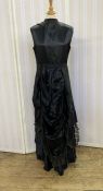 Victorian 'Natural Form' black satin dress with pleated underskirt, looped skirt trimmed with lace