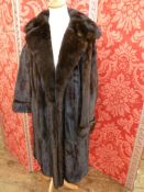 A 'Harrods' ranch mink coat, UK L. Condition ReportSlight wear to the underarms, overall good