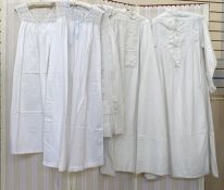 Full-length Victorian linen nightgown trimmed with lace on the bodice, sleeves and collar, a