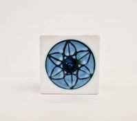 Troika cube vase with white ground, blue circular floral motif, marked to base 'Troika Cornwall