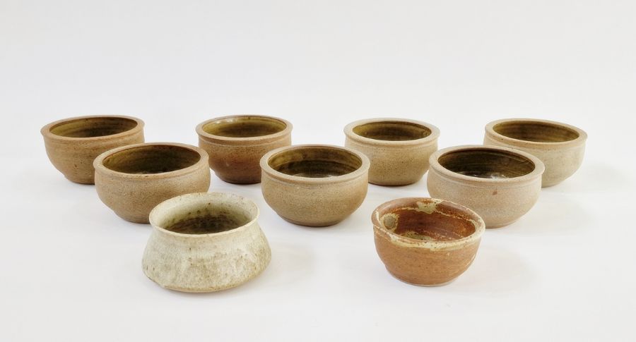 Seven similar studio pottery bowls, unmarked, a Paul Metcalfe studio pottery bowl (chips to top rim)