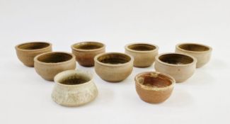 Seven similar studio pottery bowls, unmarked, a Paul Metcalfe studio pottery bowl (chips to top rim)