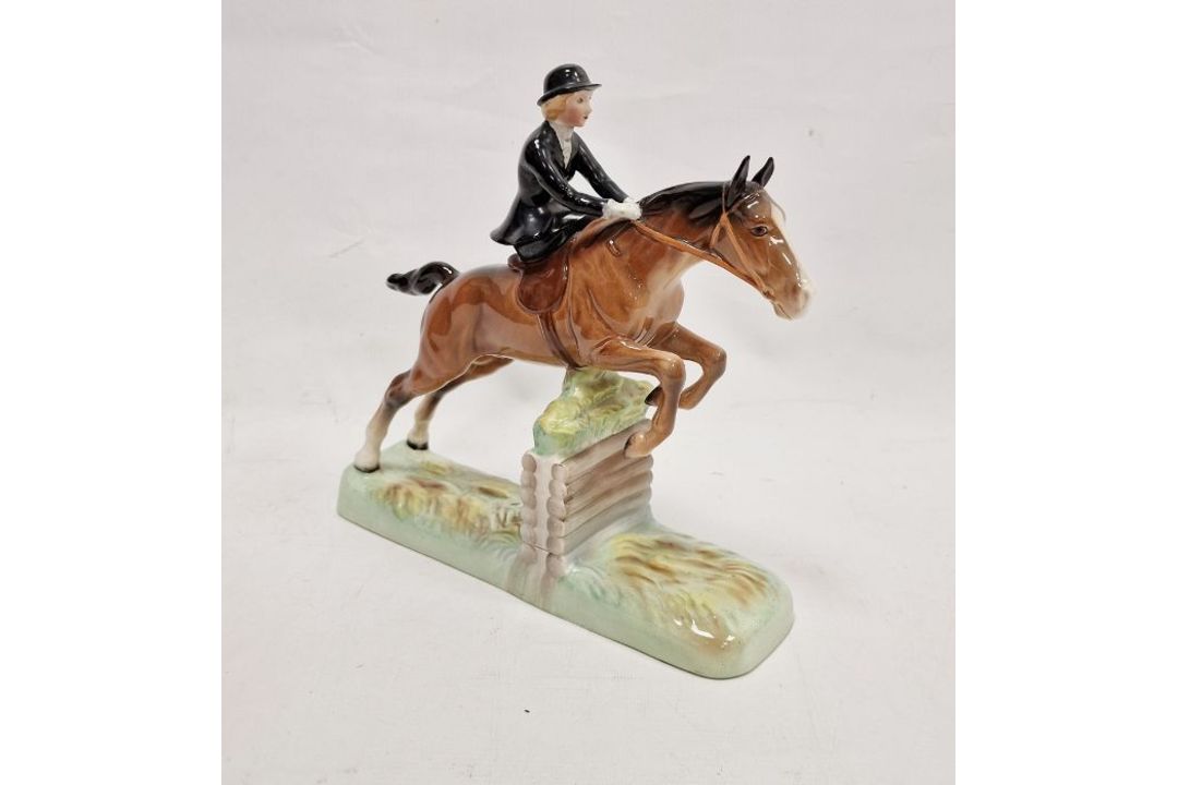 Beswick pottery model of a horse and rider jumping a fence, printed black marks, the female rider - Image 1 of 17