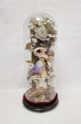 Victorian bisque porcelain figure of a lady under glass dome, on ebonised stand, modelled as a