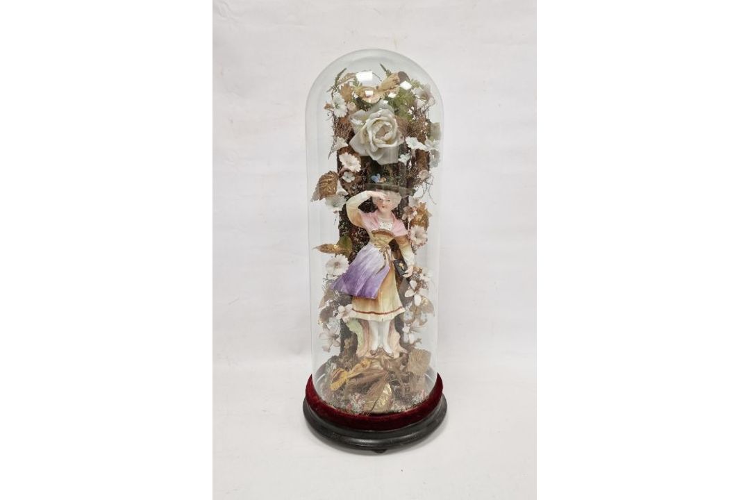 Victorian bisque porcelain figure of a lady under glass dome, on ebonised stand, modelled as a